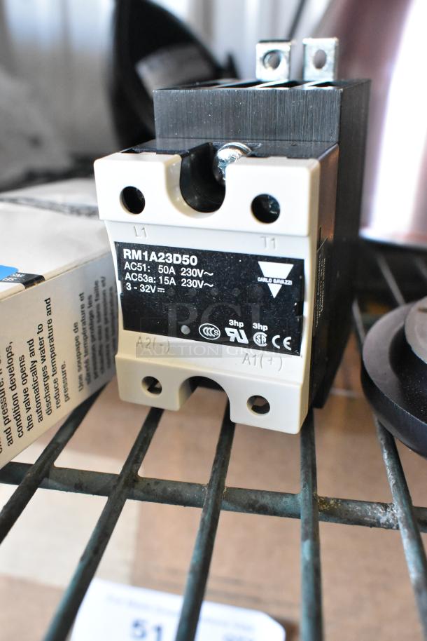 Brand new RM1A23D50 component on shelf, labeled 50A, 230V. Includes Watts 3/4 LF10L-2 and heating element.