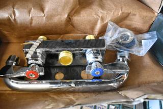 BRAND NEW Regency 600FD48 faucet, 4" centers, 8" swing spout, deck-mounted, visible minor scratches.