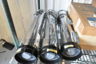 Three Modular FSF-1002 metal cup dispensers, brand new with minor scratches and dents, in chrome finish.