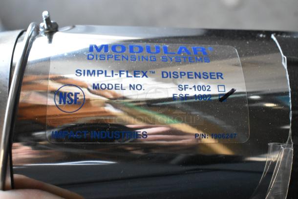 Three new Modular FSF-1002 metal cup dispensers with minor scratches, NSF approved, labeled with model and part numbers.