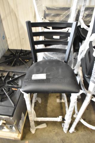 Black metal ladder back bar height chair with black seat cushion, brand new scratch and dent, wrapped for protection.
