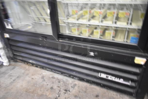 True GDM-41SL-60-LD commercial 2-door cooler merchandiser with poly coated racks, black exterior, 115 volts, 1 phase.