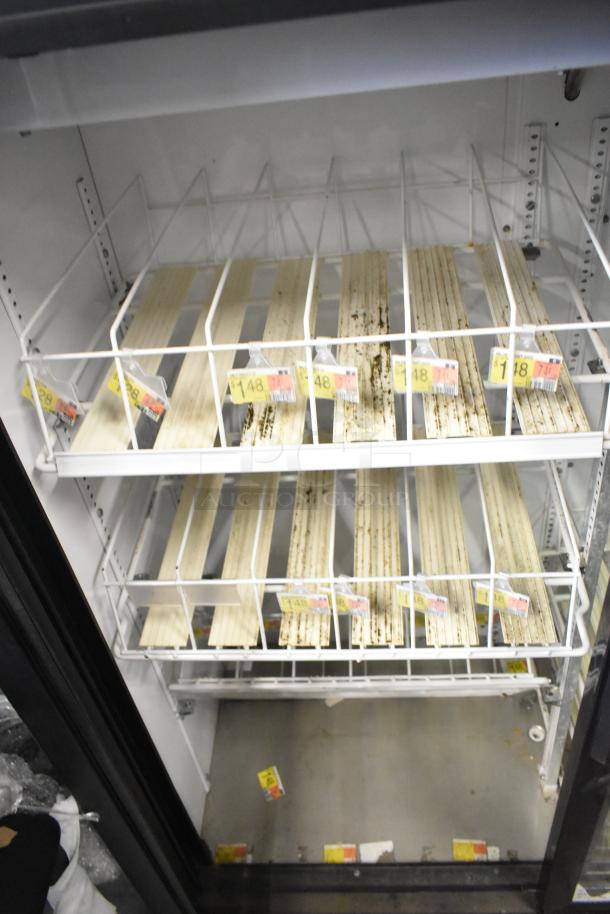 True GDM-41SL-60-LD commercial cooler, two doors, poly coated racks, visible wear, 115V, 1 phase.