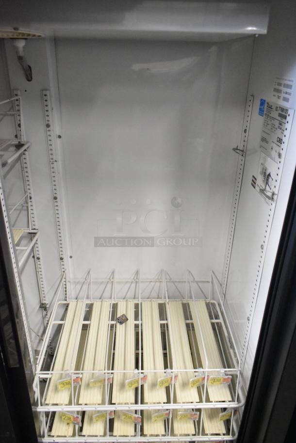 True GDM-41SL-60-LD cooler, 2-door, poly coated racks, metal frame, 115 volts, interior tags visible for model and specs.
