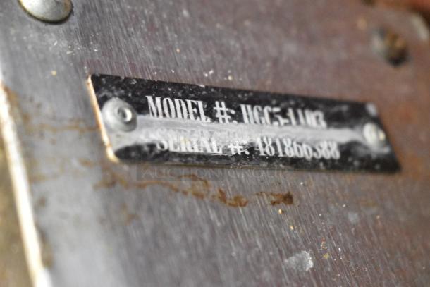 Close-up of label on Hobart HGC5-11D3 convection oven, showing model and serial number on metal surface.
