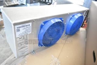 BRAND NEW SCRATCH AND DENT Krack KRD26A-089TDB-T metal evaporator fan, 115V, 1 phase, blue fans, visible specs label.
