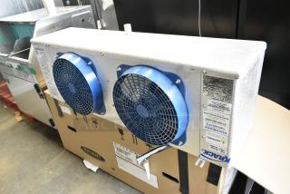 Brand new Krack KRD26A-089TDB-T metal commercial evaporator fan, 115V, 1 phase, showing visible labels and blue fans.