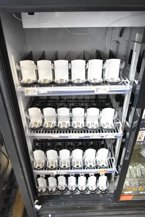 True GDM-41SL-60-LD commercial cooler, 2-door, poly coated racks, 115V, 1 phase, in used condition, shelves labeled with prices.