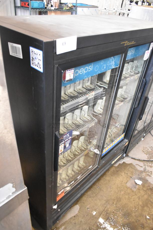 True GDM-41SL-60-LD 2 Door Reach-In Cooler Merchandiser with poly-coated racks, Pepsi branding, 115V, good condition.