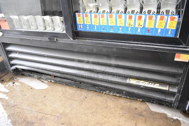 True GDM-41SL-60-LD metal cooler merchandiser with glass doors, poly coated racks, 115V, 1 Phase, moderate wear.