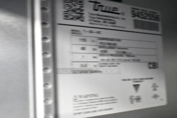 2018 True T-35-HC stainless steel commercial cooler, 2-door, with poly coated racks, 115V, 1 phase. Manufacturer's label.