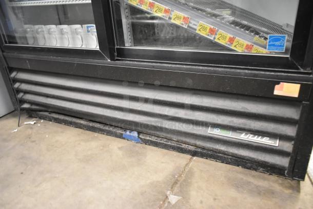 2019 True GDM-41SL-48-HC-LD 2 Door Cooler Merchandiser, black metal base, poly racks, visible brand label, used.