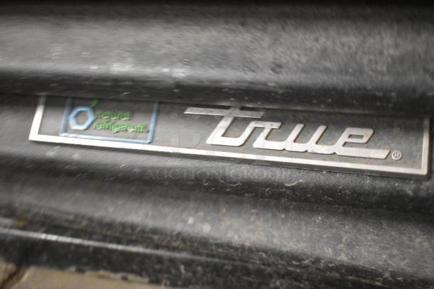 2019 True GDM-41SL-48-HC-LD metal 2-door reach-in cooler; visible "True" logo; natural refrigerant label.
