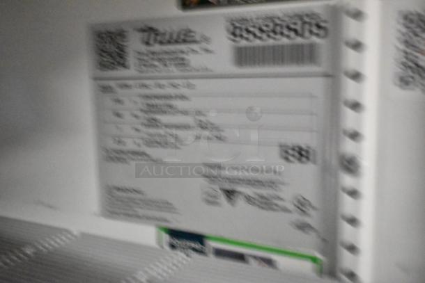 Blurry label on 2019 True GDM-41SL-48-HC-LD 2 Door Reach In Cooler, item details unclear. Model, brand, and specs not visible.