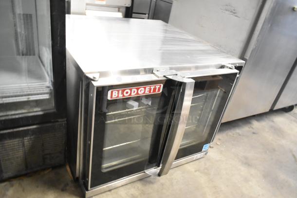 Blodgett Hydrovection Helix stainless steel convection oven with view-through doors and metal racks, excellent condition.