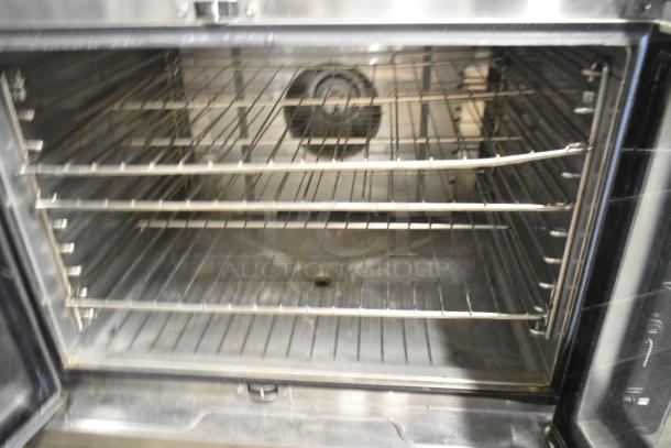 Blodgett Hydrovection Helix stainless steel convection oven with view-through doors and metal oven racks, open door view.
