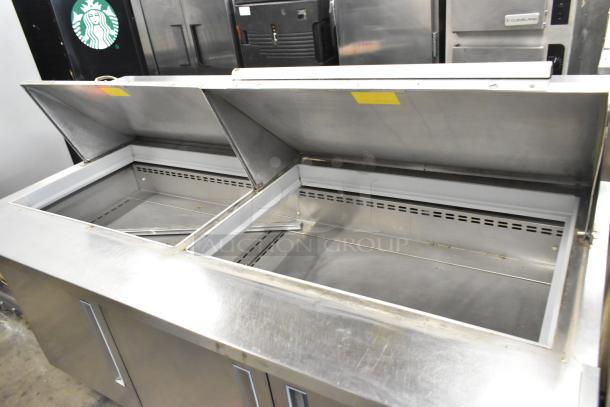 2019 Berg EDMT 72 30 stainless steel prep table, dual compartments, commercial casters, 115V, 1 phase, good condition.