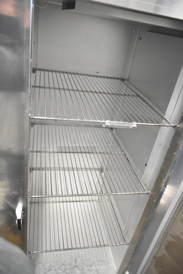Traulsen AHT132WUT-FHS stainless steel commercial single door reach-in cooler with racks, 115 volts, 1 phase.