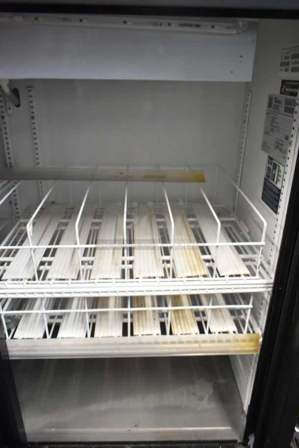 2019 True GDM-41SL-48-HC-LD 2-door cooler, metal finish, poly-coated racks, 115V, 1 phase, interior shelf wear visible.