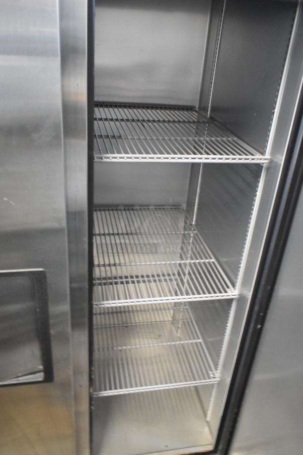 2021 True T-35-HC 2 Door Reach In Cooler, stainless steel, poly coated racks, excellent condition, 115V, 1 Phase.
