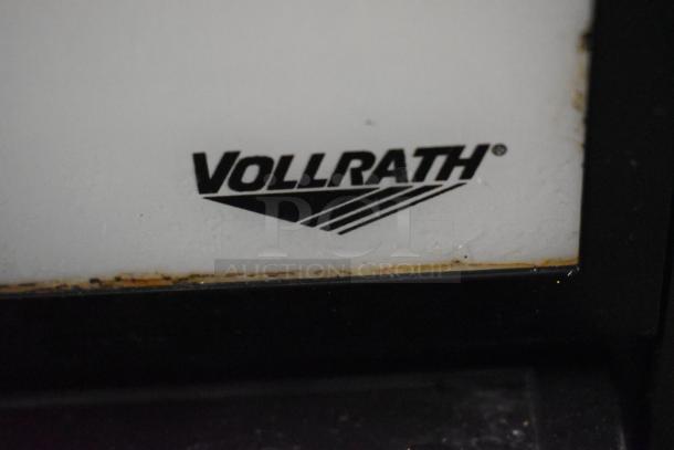 Vollrath VCBA168-37 logo on a commercial slushie machine. Model is a triple hopper with 1.6-gallon capacity.