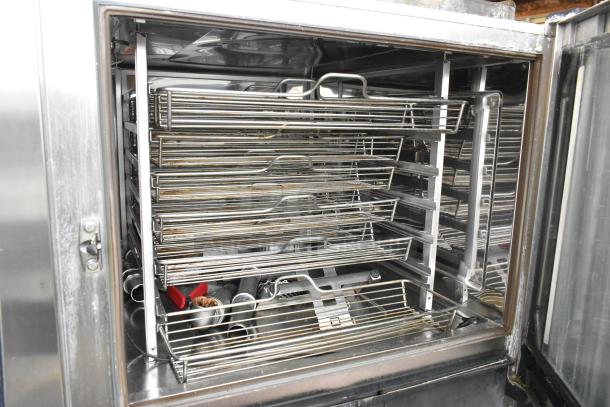 Stainless steel Rational iCombiPro convection oven interior with multiple racks, showing signs of use. 440/480V, 3-phase.