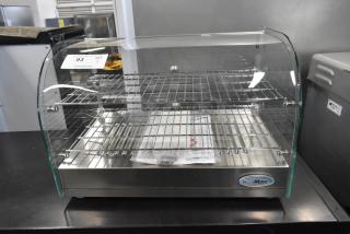 Brand new KoolMore HDC-1.5C curved glass display warmer. Scratch and dent, 115V, 1 phase. Two shelves, stainless steel.