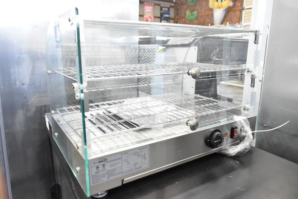Brand new KoolMore HDC-1.5C Curved Glass Display Warmer, 115V, 1 Phase, stainless steel body, dual shelves, minor scratches.