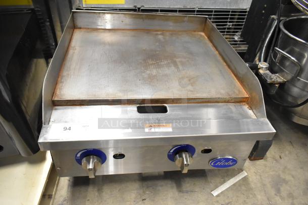 Globe GG24G stainless steel countertop gas griddle, 60,000 BTU. Dual dials, branding on the front. Used condition.