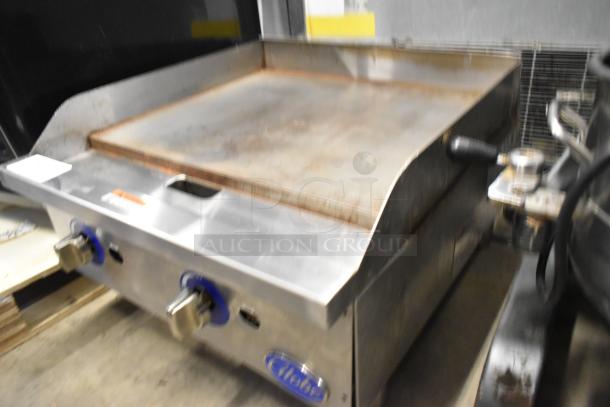 Globe GG24G stainless steel commercial gas griddle, 60,000 BTU. Countertop model features dual control knobs.