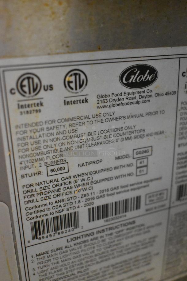 Globe GG24G stainless steel countertop griddle label. Commercial use, 60,000 BTU, ETL certified, model details, and instructions.