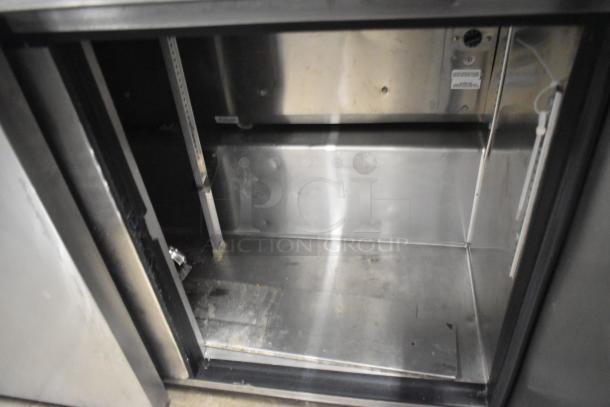 True TUC-48F-LP stainless steel undercounter freezer. 2 doors, interior shelving, 115V, commercial use, clean condition.