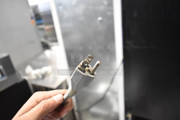 Close-up of a power plug for a Bizerba SE 12 US commercial meat slicer, 120 volts, 1 phase.