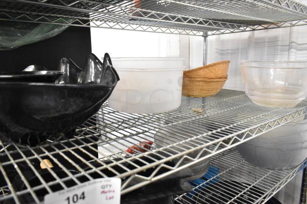 Metro lot of mixed items: black and clear bowls, white poly bin, wicker basket. Does not include shelving unit.