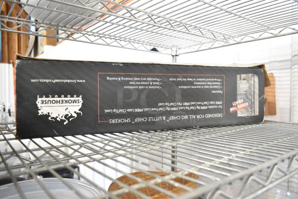 Metro lot on wire shelf includes Smokehouse Products item box, plates, and bowls visible. Poly bin noted. Shelving unit excluded.