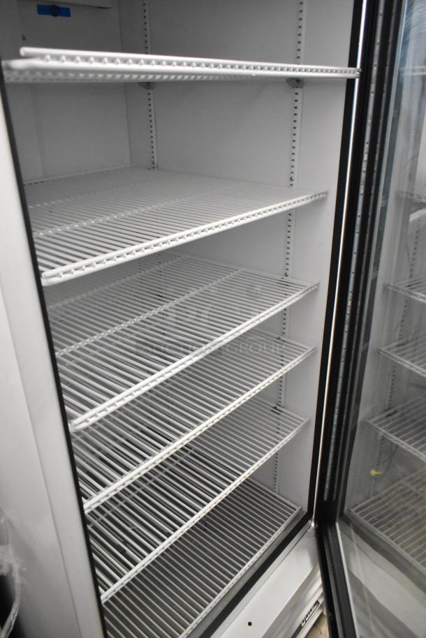 2021 True TSCI-600R-G-PH reach-in cooler, single glass door, poly-coated racks, metal frame, 115V, excellent condition.