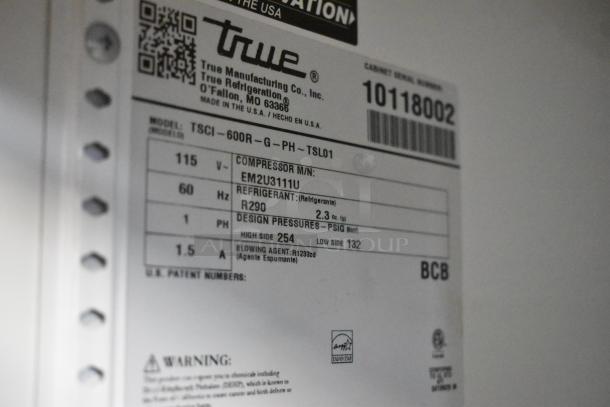 Label on 2021 True TSCI-600R-G-PH commercial cooler, showing model, voltage, compressor, refrigerant details, and certifications.