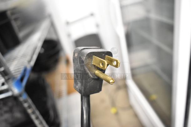 Close-up of a power plug for a 2021 True TSCI-600R-G-PH commercial single door cooler.