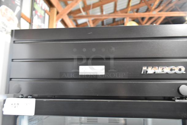 2019 Habco SE18 metal commercial single door reach-in cooler, black exterior, Habco logo visible, with poly-coated racks.