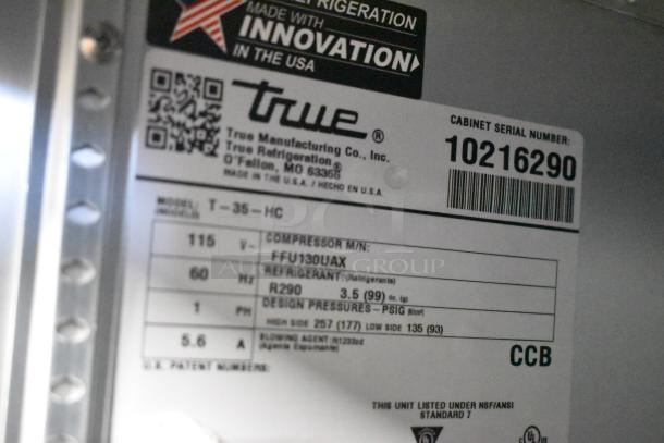 2021 True T-35-HC stainless steel commercial cooler label. 2 doors, poly coated racks, 115V, 1 phase. Model, refrigerant details.