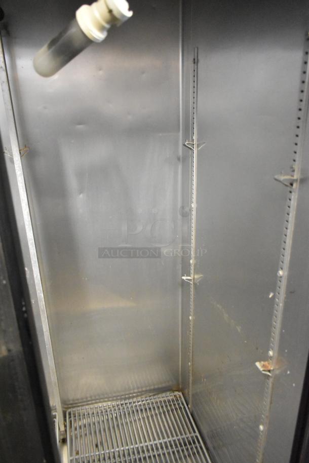 2017 True T-35 stainless steel 2-door reach-in cooler interior, poly-coated racks visible, commercial use, 115V, 1 phase.