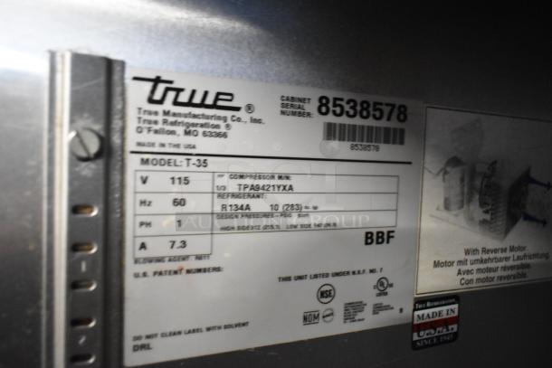 2017 True T-35 stainless steel commercial cooler, 2 doors, poly coated racks, 115 volts, 1 phase; serial number 8538578.