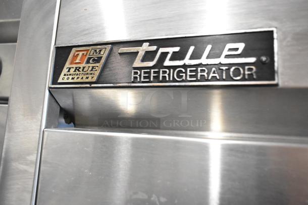 2017 True T-35 stainless steel commercial cooler, 2-door, poly-coated racks, 115V, 1 phase, logo label.