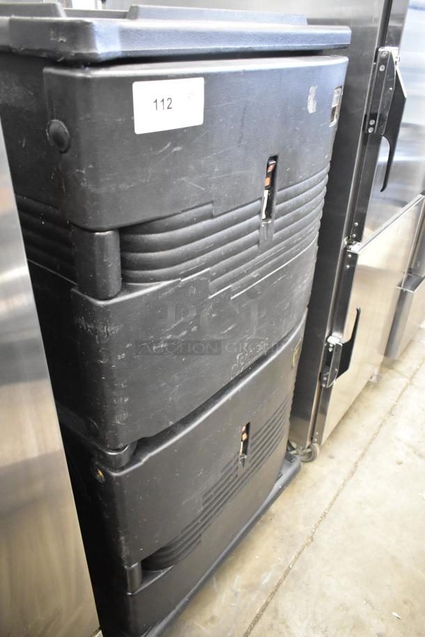 Cambro black poly 2 compartment heated holding cabinet, showing signs of use, with latch openings; labeled "112."