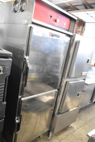 Wittco 1200-2E1ZN stainless steel heated holding cabinet on casters, 208-240V, 1 phase, red control panel, sturdy condition.