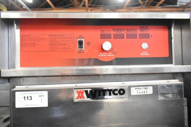Wittco 1200-2E1ZN stainless steel heated holding cabinet, visible control panel, commercial casters, 208-240V, 1 phase.