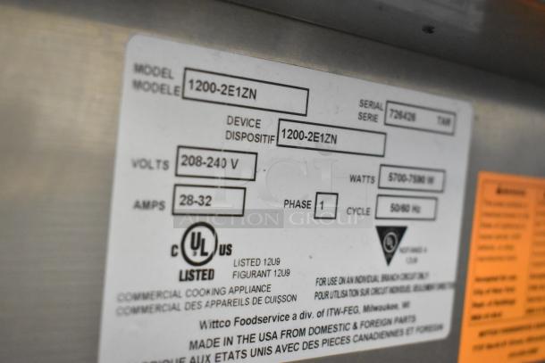 Wittco 1200-2E1ZN stainless steel commercial heated holding cabinet label showing model, volts, amps, phase, and UL listing.