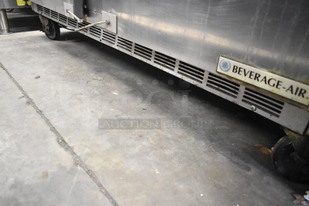 Beverage Air SPE60-16C stainless steel sandwich prep table, with visible branding, on commercial casters.