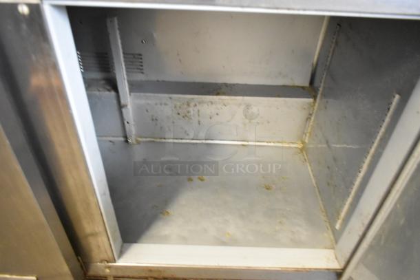 Beverage Air UCR72AY-23 stainless steel undercounter cooler, 3 doors, visible interior wear, 115 volts, 1 phase.