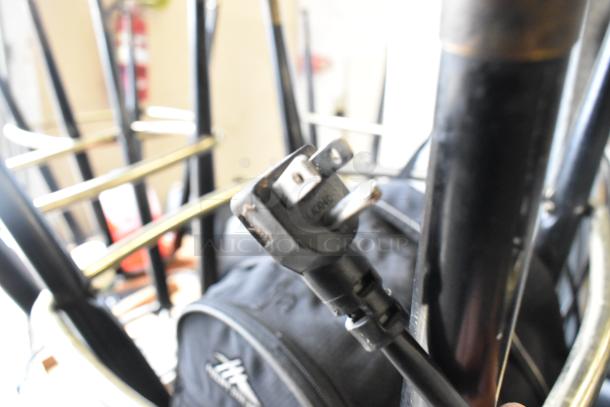 A close-up of a power plug and cable, unclear in association with the Continental 1FE freezer. Background obscured.